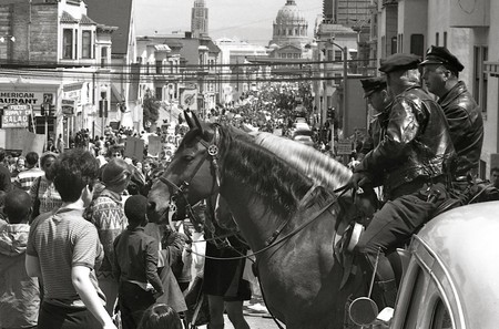 Mounted policemen watch a protest march in San Francisco on April 15, 1967. The San Francisco City Hall is in the background | © George Garrigues/WikiComons