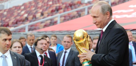 Russia president Vladimir Putin holds the World Cup Trophy