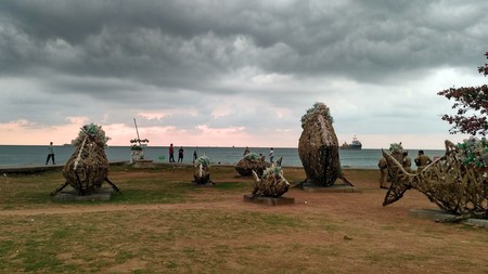 Sculptures arranged on the beach from the 2014 Kochi-Muziris Biennale