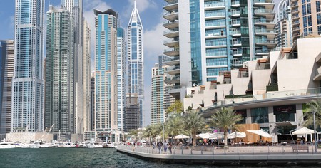 Cafés and restaurants along the Dubai Marina waterfront walkway.