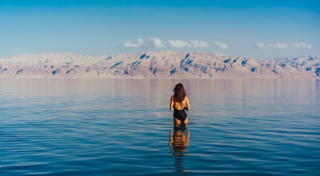 Floating on the surface of the Dead Sea's hyper-salty water is about as surreal and relaxing as it gets
