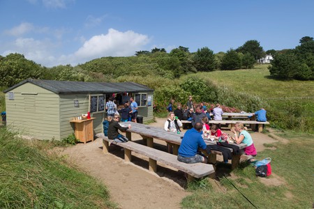 Hidden Hut at Porthcurnick Beach in Cornwall offers a truly authentic seaside experience