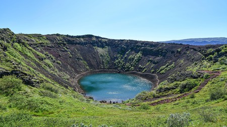 Kerið is a turquoise, water-filled caldera in southern Iceland