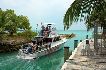 Dive boat leaving Stuart Cove s Aqua Adventures centre New Providence Island Bahamas