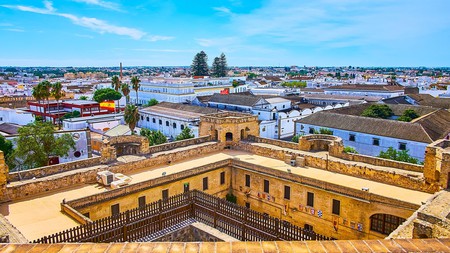 The top city view from tower of Santiago Castle, observing tile roofs of sherry wineries and living quarters, Sanlúcar de Barrameda.