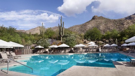 Soak up the mountain views from your lounge chair at Loews Ventana Canyon Resort in Tuscon