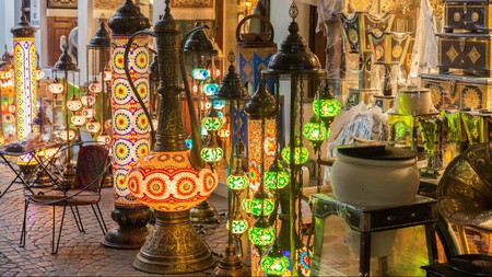 Browse intricately-detailed lanterns, handwoven fabrics and spices at the bustling Bab el-Bahrain Souq in Manama 