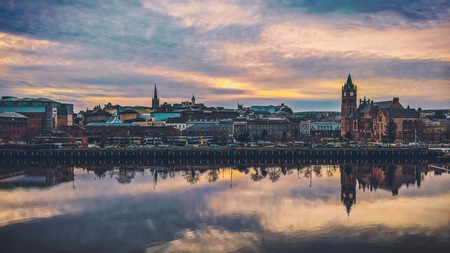 The sun sits low over the Cityside and the River Foyle, Londonderry, Northern Ireland