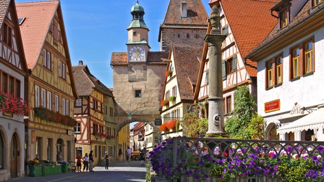 Rothenburg ob der Tauber is a walled medieval town filled with flower-filled window boxes, cobblestone alleyways and painted houses 