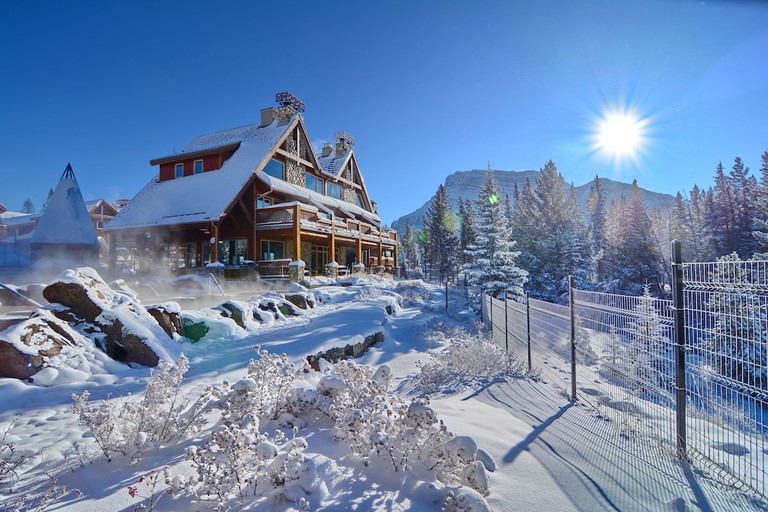 The chalet-style lodge at Hidden Ridge Resort is covered in snow