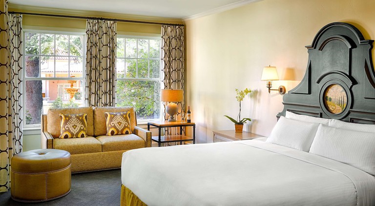 Two double beds in an elegant room with a fireplace and a flat-screen TV at Fairmont Sonoma Mission Inn & Spa