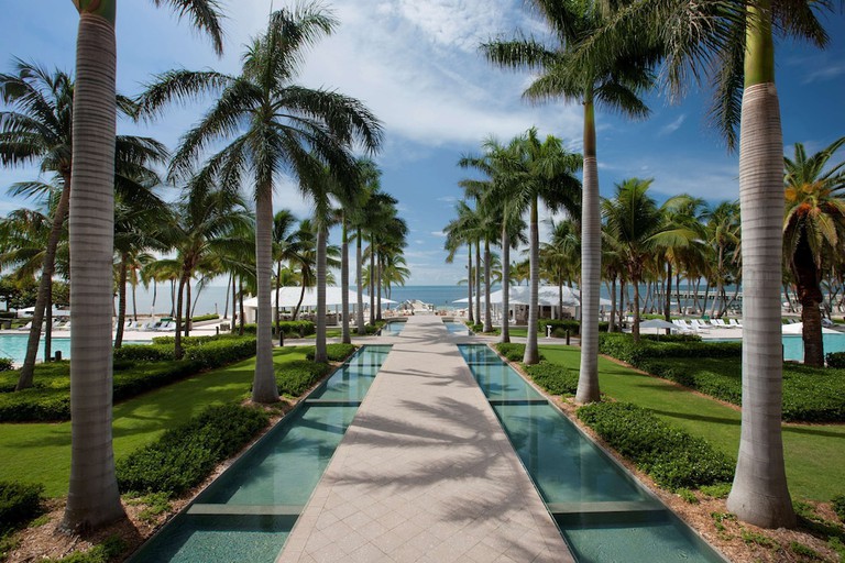 Dramatic water-rimmed walkway toward beach at Casa Marina Key West, A Waldorf Astoria Resort, in Key West