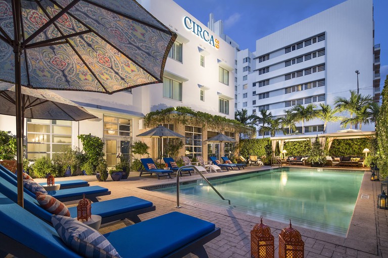 Outdoor dining area with playful patterns and vibrant colors at Circa 39 Hotel in Miami Beach