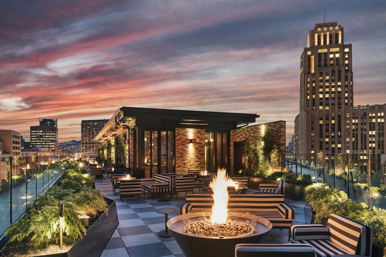 Chic rooftop lounge with fire pit at San Francisco Proper