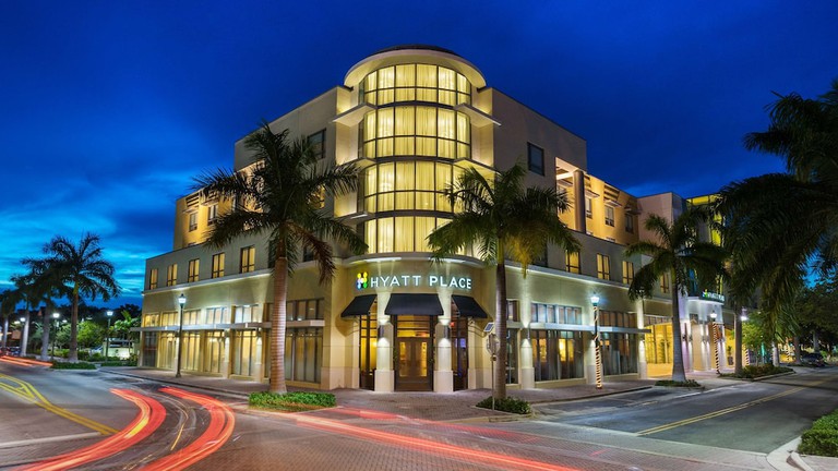 Large suite with separate work and bedroom areas at Hyatt Place Delray Beach