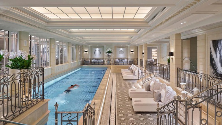 Indoor pool and lounging terrace at the Four Seasons Hotel George V, Paris.
