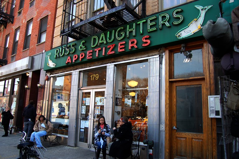 Customers eat their food outside of the family-owned Russ & Daughters, New York City.