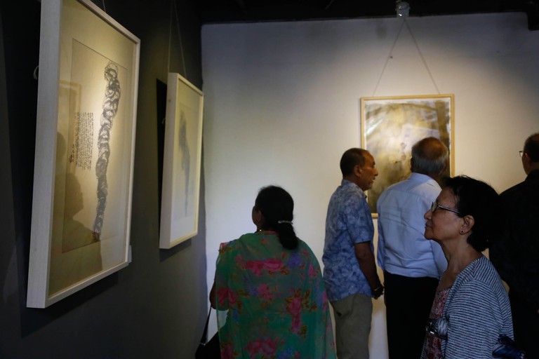 Visitors observe the Sino Nepal Cultural Communication Art Exhibition at Park Gallery in Pulchowk, Nepal