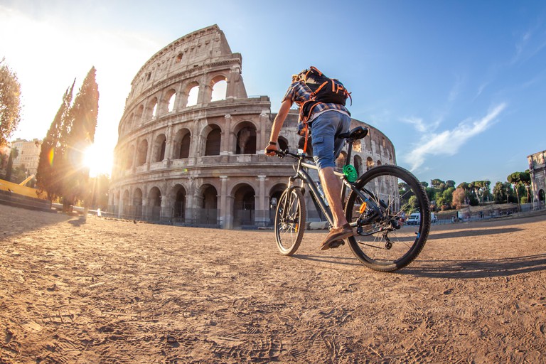 Tourist colosseum in Rome, Italy at sunrise.