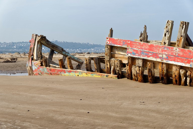 A red-painted Old Fishing Boat Wreck at crow point