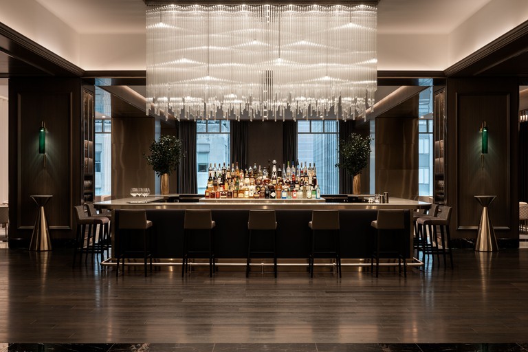 A modern bar with lots of bottles at the Four Seasons Chicago