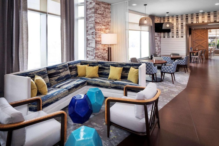 The stylish lobby seating area at Hyatt Place Long Island East End