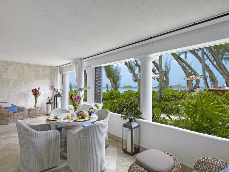 A terrace with garden and sea views at the Colony Club by Elegant Hotels