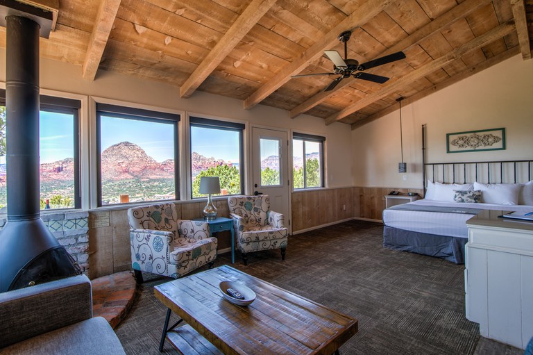 Large bedroom with views over the mountains at Sky Ranch Lodge