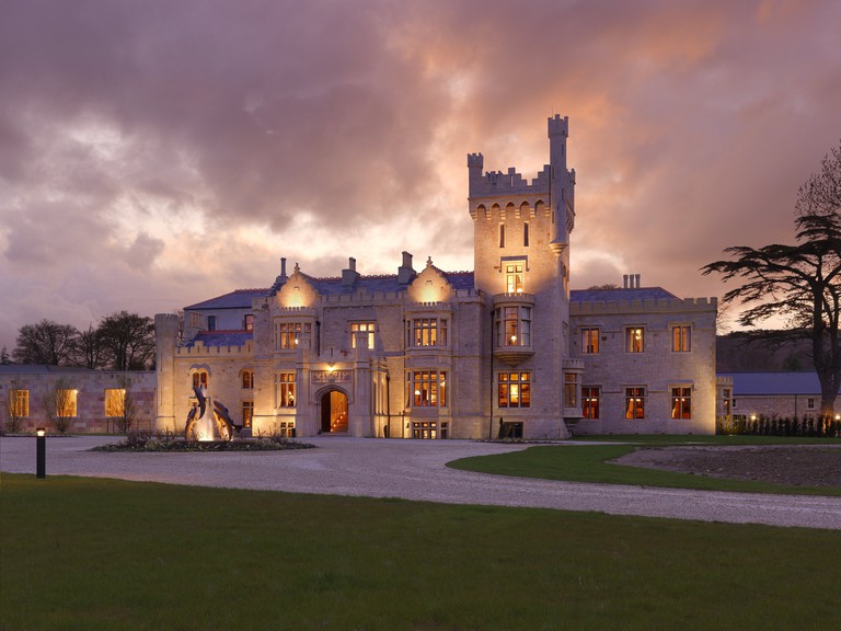 Dusk hits Lough Eske Castle in Donegal, with lights illuminating the front of the property