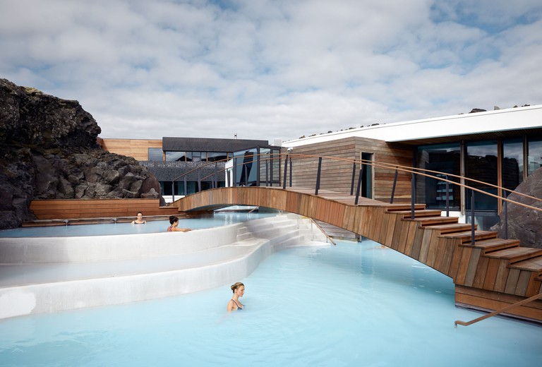 The Retreat at Blue Lagoon Iceland with footbridge and blue waters