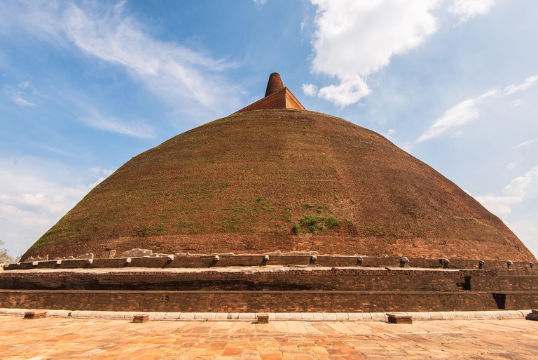 Giant red brick stupa of Abayagiri Monastery. Anuradhapura in cultural triangle of Sri Lanka