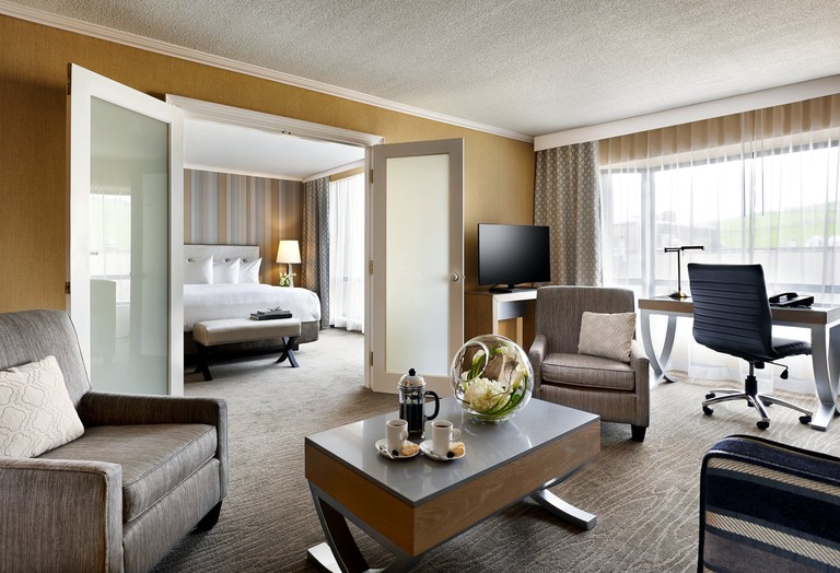 A spacious, light-filled suite at the Prince George Hotel