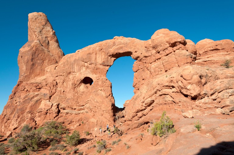 Utah, Arches National Park, visitors on Windows Trail, Turret Arch. Image shot 2011. Exact date unknown.