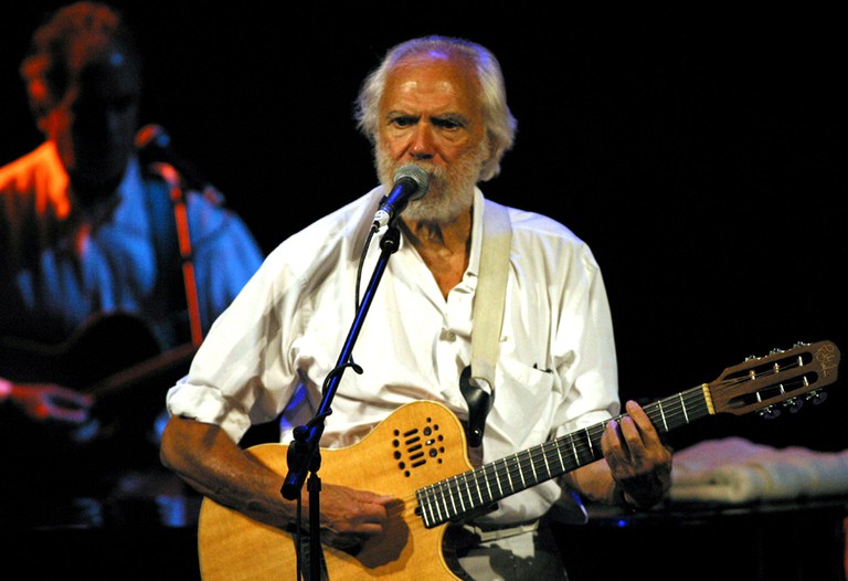 French singer and composer Georges Moustaki performs during the 22th International Festival of The Medina in the Municipale Theatre in Tunis late 0ctober 26, 2004. [The festival is held annualy with the participation of dozens of international bands and s