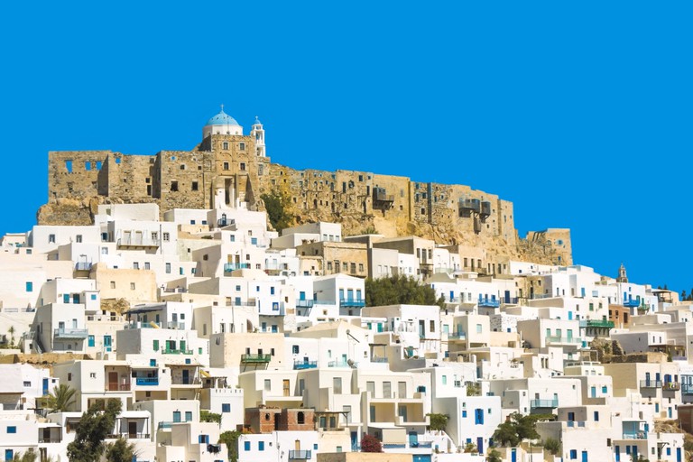 Greece the beautiful island of Astypalaia.  The dramatic old town with it's ancient castle. Clear blue sky on a summers day.  Copy space.