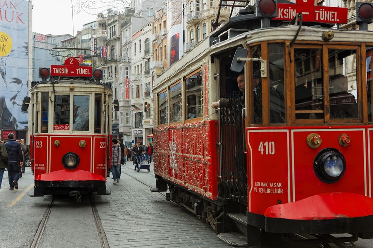 Nostalgic trams in Istiklal Street ride between Taksim and Tunnel square in istanbul