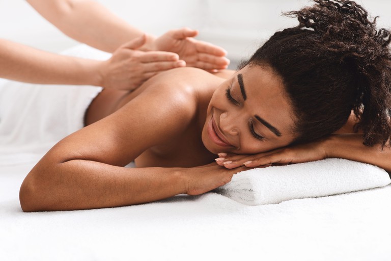 Woman receives a back massage