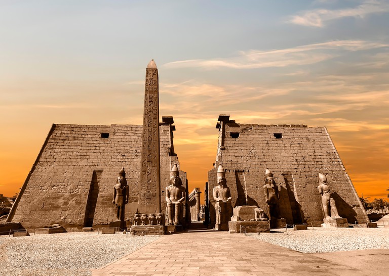 Entrance to Luxor Temple at sunset, a large Ancient Egyptian temple complex located on the east bank of the Nile River in the city today known as Luxo