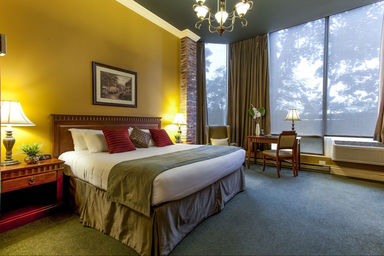 A large double room at Le Nouvel Hotel and Spa with stunning outdoor views