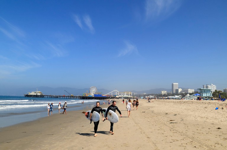 Surfer at Santa Monica Beach, Los Angeles, California, USA