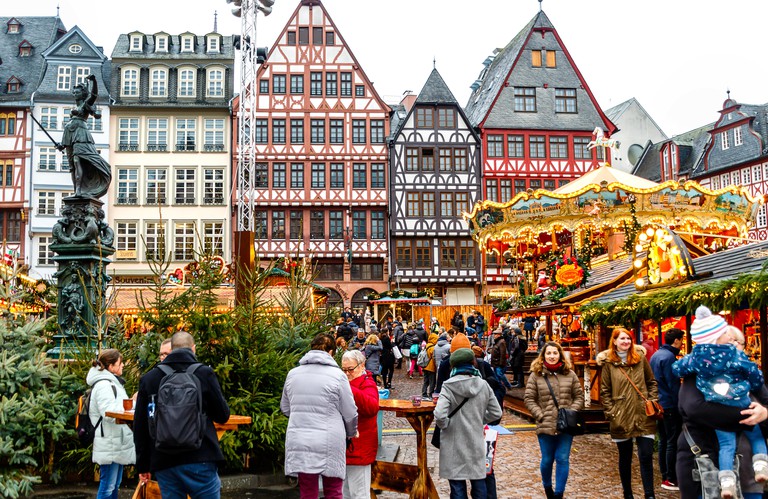 FRANKFURT AM MAIN, GERMANY-NOVEMBER 30, 2018: Colorful crowds at the traditional (since 1393) Christmas market in historic center of Frankfurt