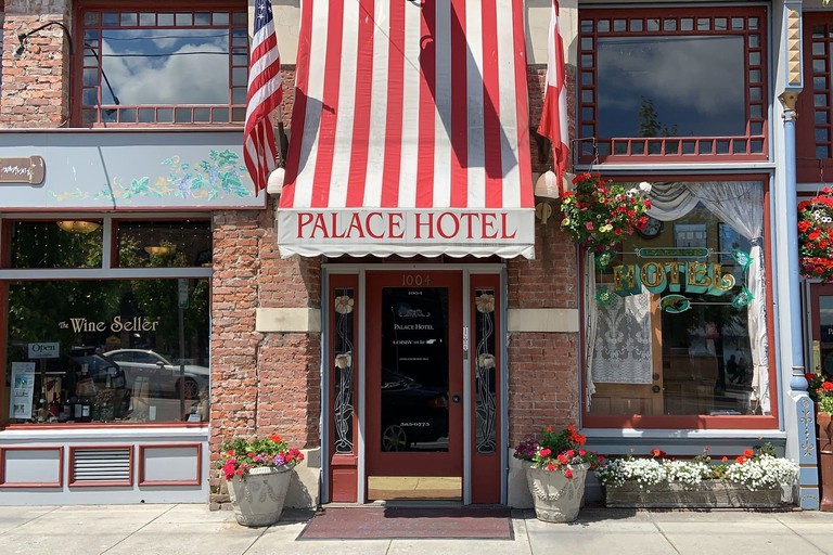Palace Hotel Port Townsend entrance with a red and white striped awning in vintage style