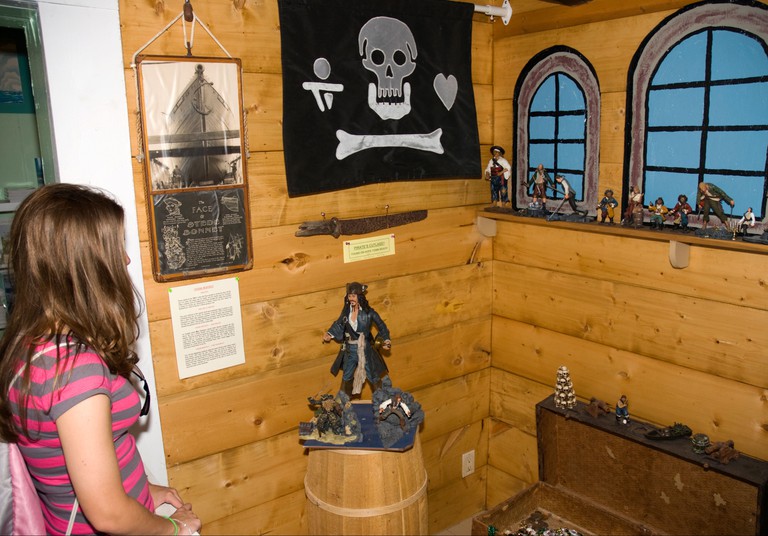 Girl looking at display, Wyannie Malone Historical Museum, Hope Town, Abaco, Bahamas. Image shot 2009. Exact date unknown.