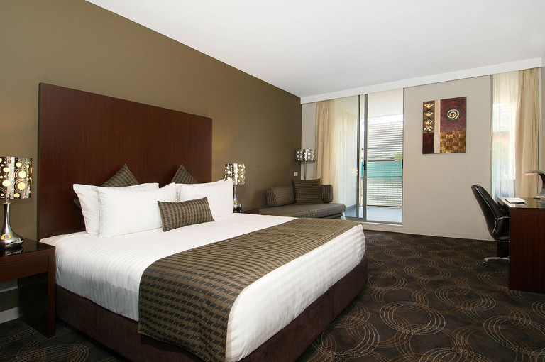 A premier king room at Hotel 115