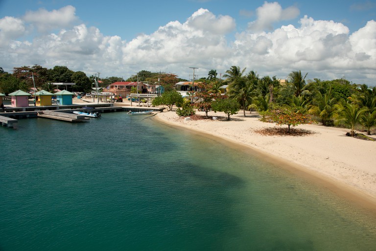 Belize, Placencia. Sandy beach along the Placencia port area