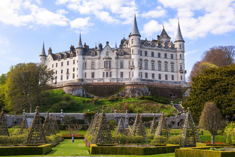 Old Dunrobin castle in the background and stunning garden in the foreground, 16th of April 2017. Sutherland, Scotland, UK.