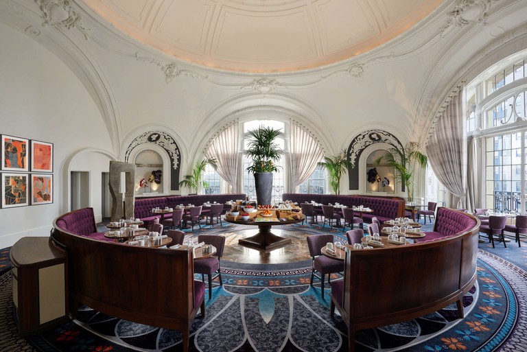 The Cameo Room of the XIX Restaurant at the Bellevue Hotel, with curving archways and alcoves, ornate plasterwork, leaded windows and velvet seating