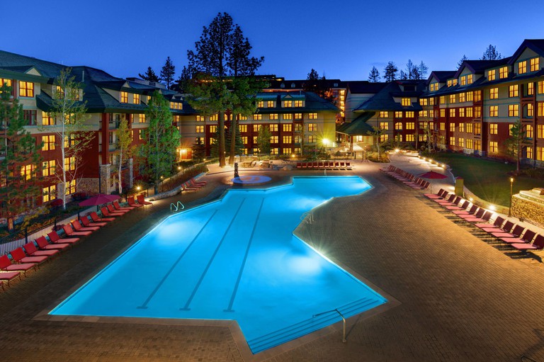 Nighttime view of expansive pool area at the center of Marriott's Timber Lodge in South Lake Tahoe, California