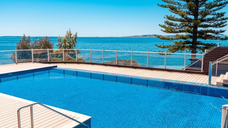 An outdoor swimming pool at Port Lincoln Hotel with views over Boston Bay
