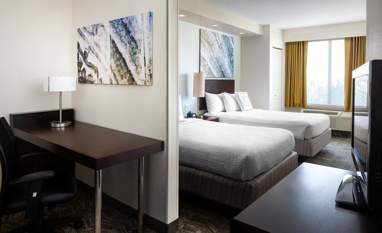 A bright suite with two beds at SpringHill Suites by Marriott Bakersfield